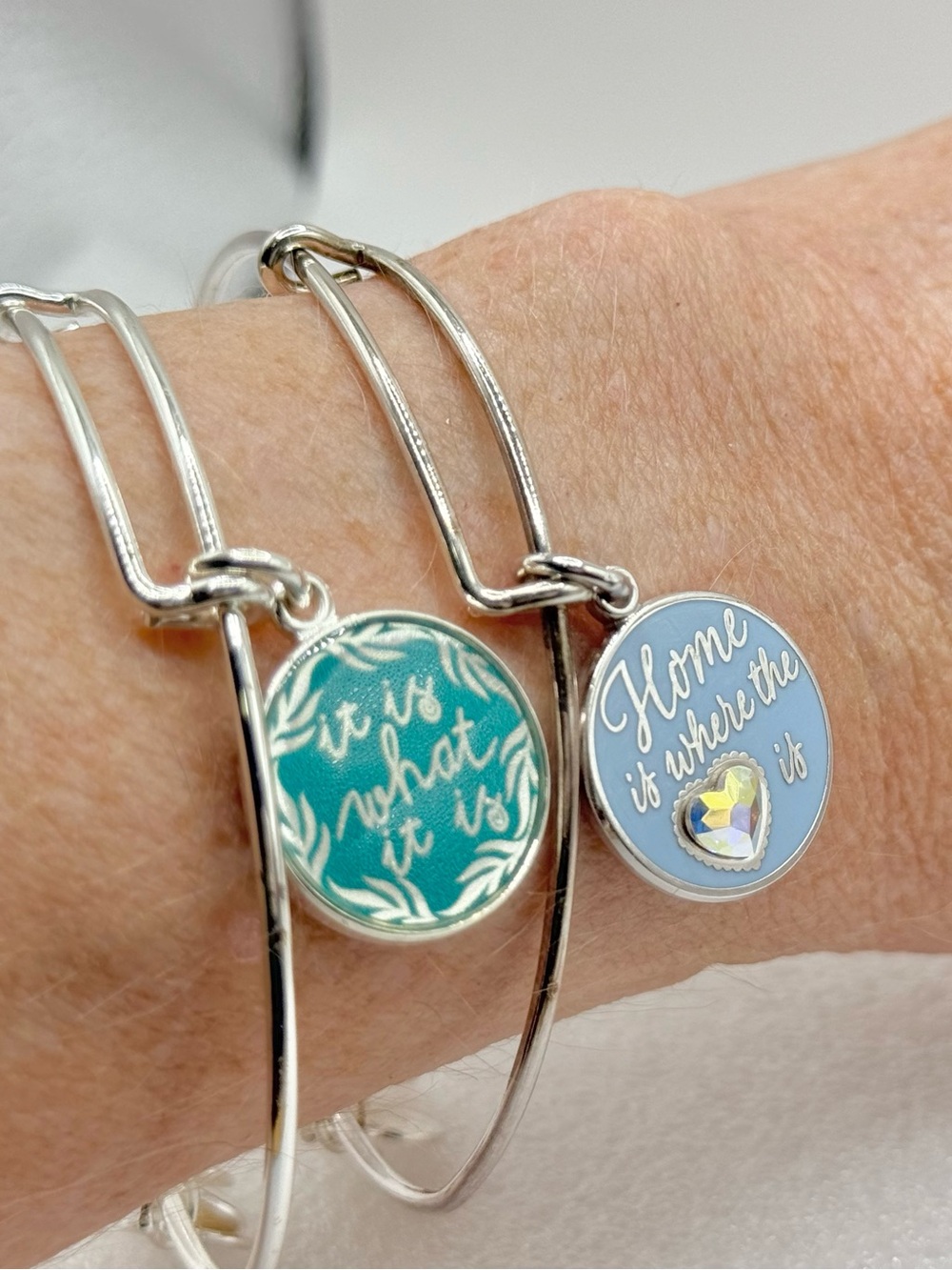Two Alex and Ani "It Is What It Is" bangle "Home is where the" and a heart-shape